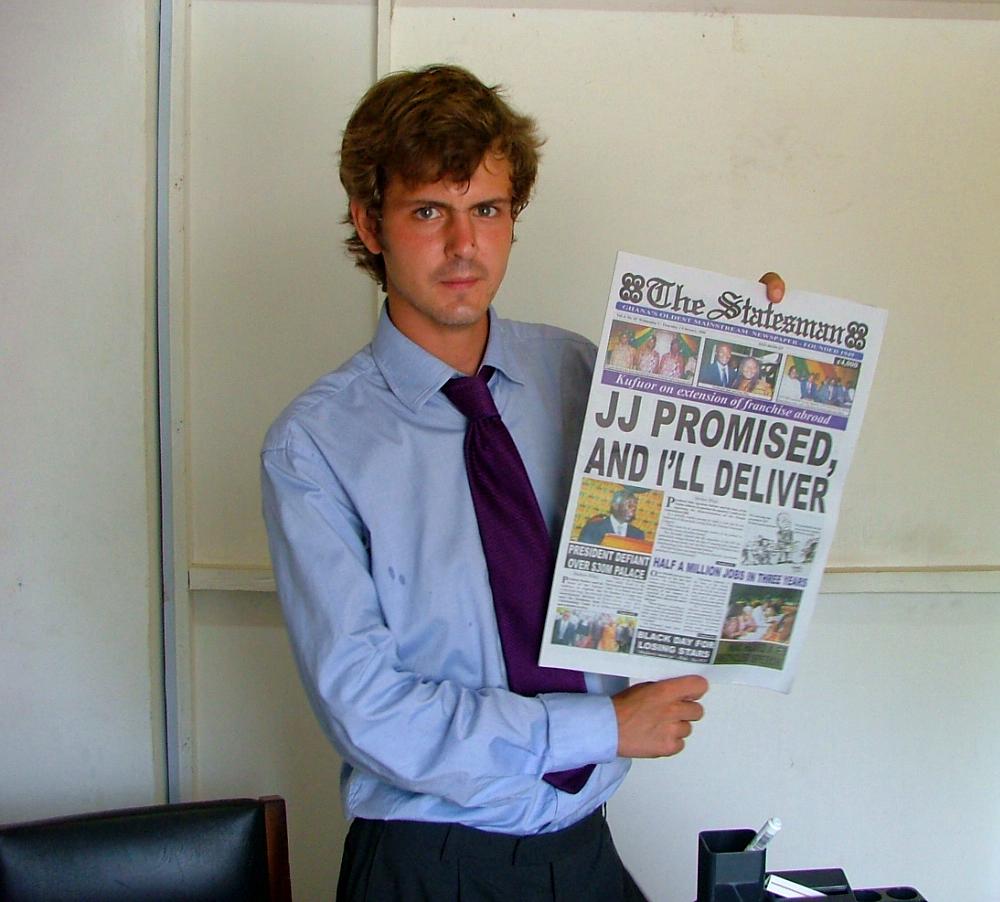 A Projects Abroad journalism intern showcases a newspaper An intern at a journalism placement in Ghana holds up a newspaper